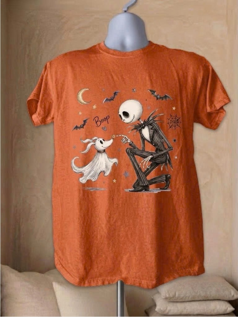 Vintage Orange Halloween Graphic Tee with Playful Ghost and Skeleton